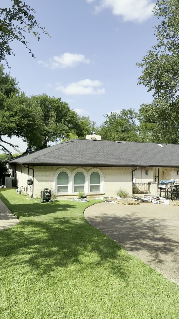 Single-story home with a freshly finished dark shingle roof
